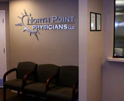 Doctors office sign with 3D letters and logo of metal laminate mounted on acrylic