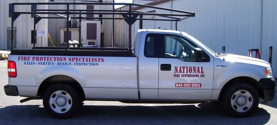 picture of a commercial pick-up truck with vinyl lettering