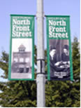 Street pole mount vinyl banner.